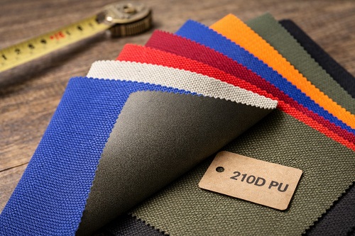 На фото: Образцы оксфорда 210D с различными покрытиями